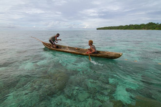 Two fisherman put out a net to catch reef fish, Fumato'o, Malaita Province, Solomon Islands. Photo by Filip Milovac.